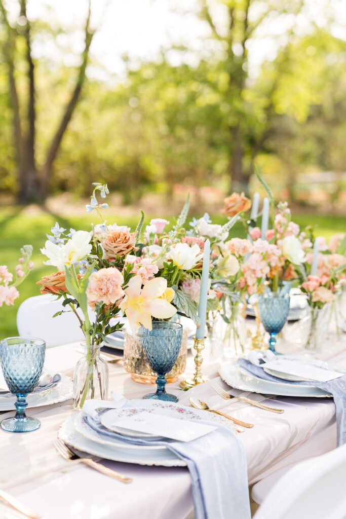 Vintage pastel themed table decorations and florals