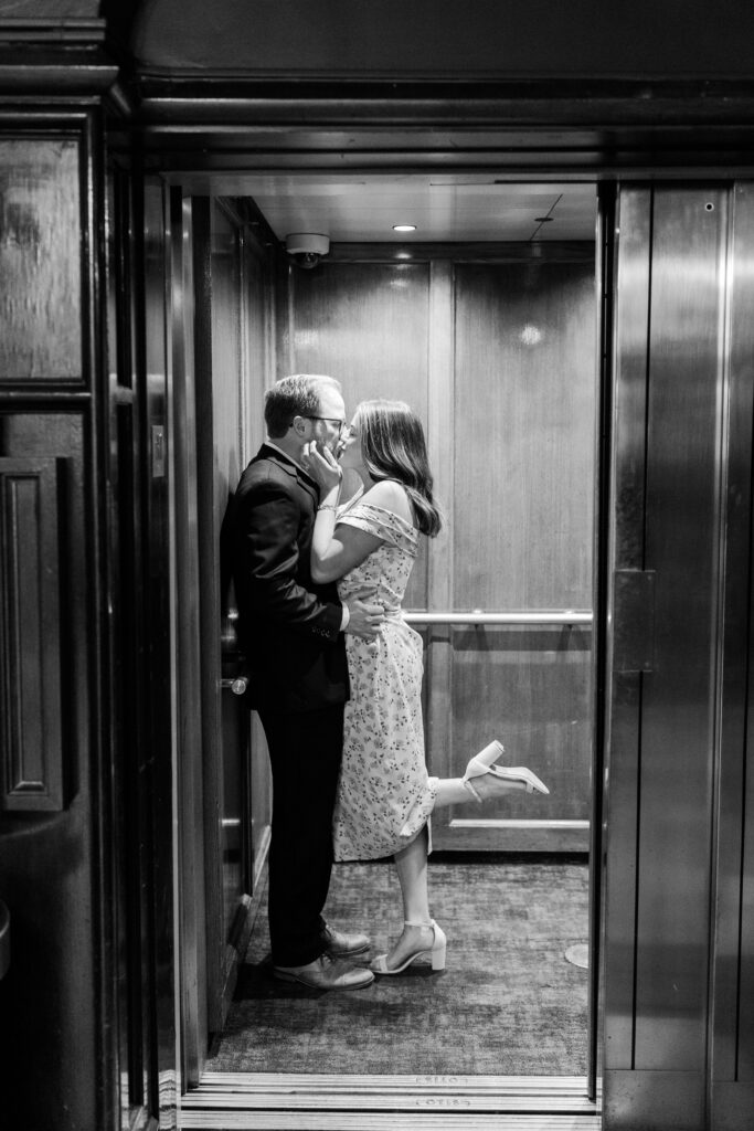 Romantic photo of a couple enjoying a kiss in a hotel elevator