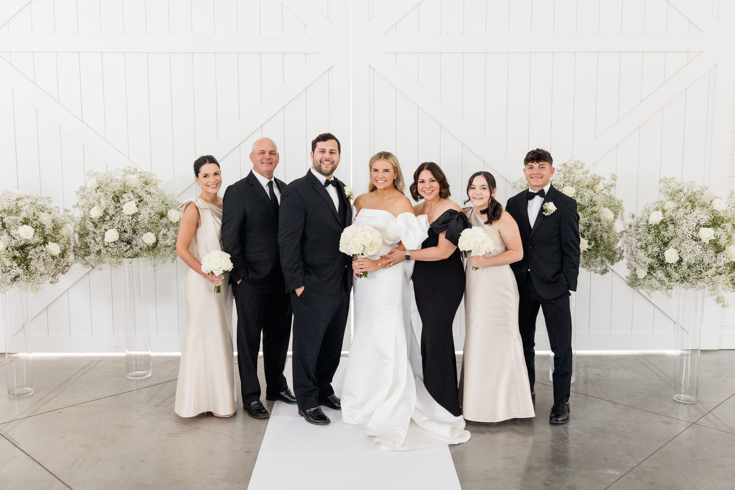 Indoor wedding family photos at black and white wedding